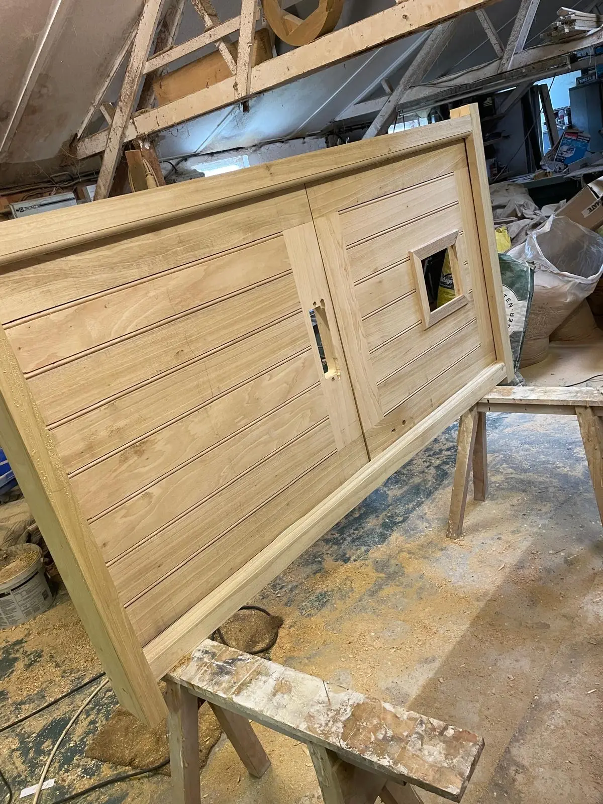 Bespoke oak ledged stable-style door with tongue-and-groove boards and a glazed light