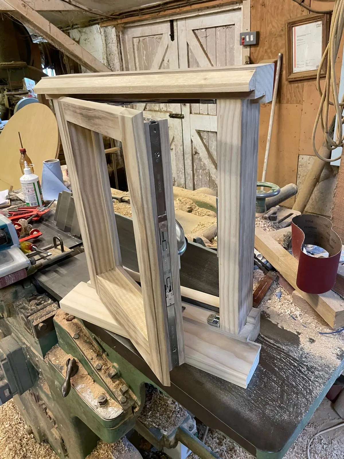 Bespoke timber casement window with mortice lock, freshly made on the workbench
