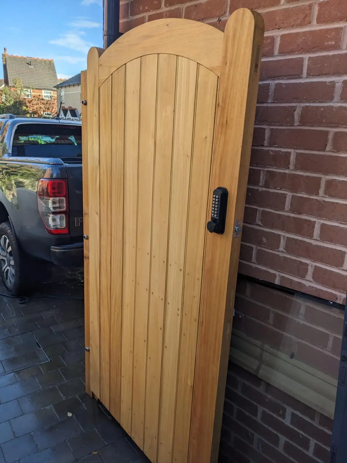 Arched-top tongue-and-groove timber side gate with keypad lock