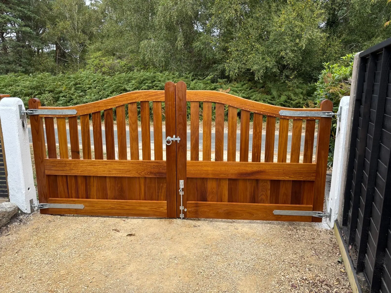 Handmade timber driveway gates installed at a Dorset home